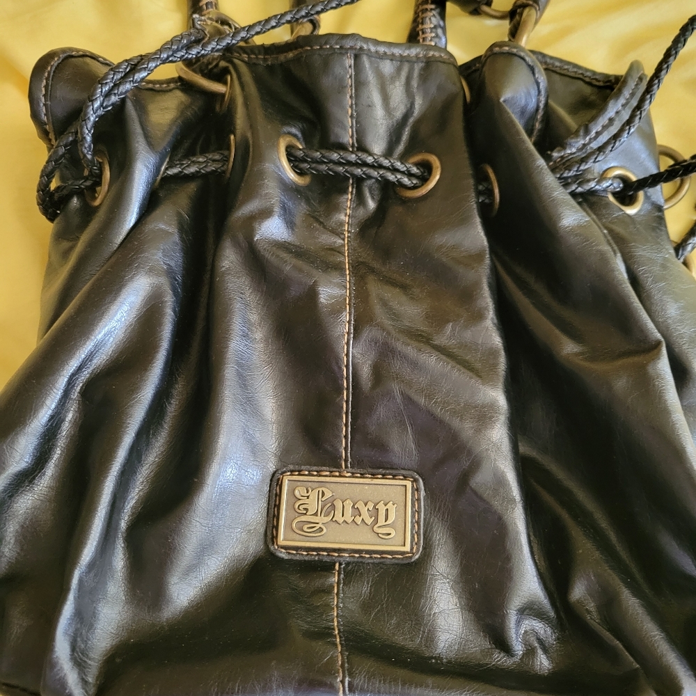 Black Luxy medium sized black patent leather purse or satchel.